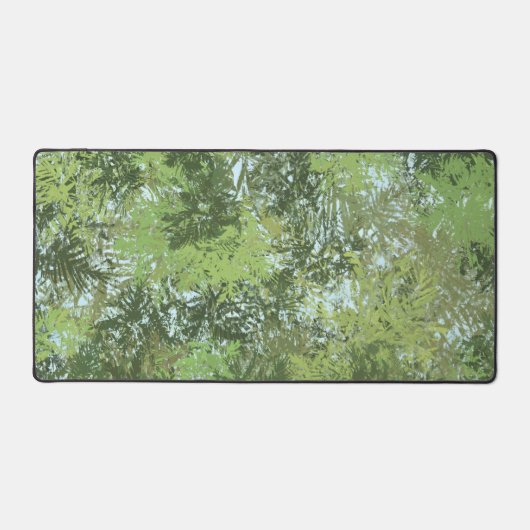 Green Leaf Trees With Blue Sky Peaking Through Art デスクマット (正面)