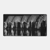 Group of Plains Zebra Drink Together at Night デスクマット (正面)