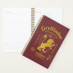GRYFFINDOR™ Determination Courage Bravery Crest プランナー手帳<br><div class="desc">Show your house pride with this bold Gryffindor™ crest design, celebrating the values that define the bravest of witches and wizards. Featuring the iconic lion standing proudly before a shield, this striking artwork highlights Gryffindor’s core traits — Courage, Determination, and Bravery — in a powerful, vintage-inspired layout. The rich house...</div>