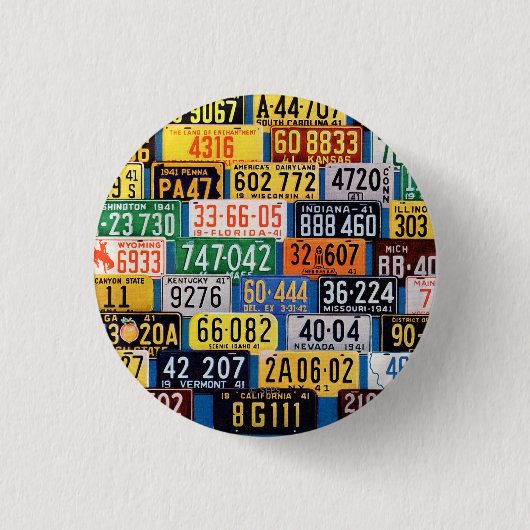 H.ウイルソンスミス著ナンバープレート 缶バッジ (正面)