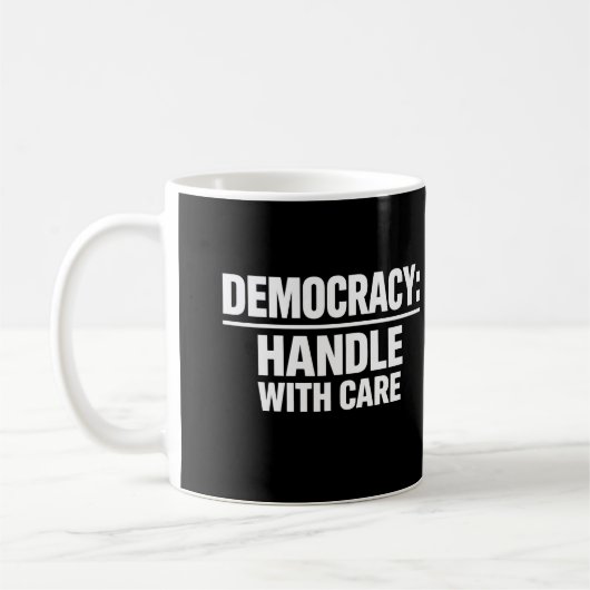 Handle Democracy With Care コーヒーマグカップ (左)