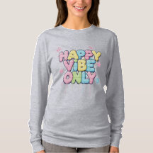 「Happy Vibe Only」とカラフルな文字が書かれたレンガ