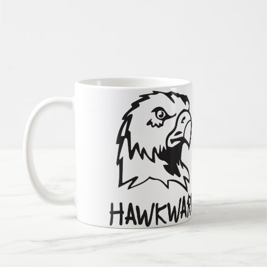 Hawkward -扱いにくいタカのしゃれ コーヒーマグカップ (左)