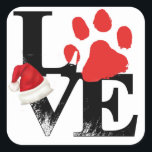 Holiday Santapaws -Paw Print in Christmas LOVE スクエアシール<br><div class="desc">"V"と"E"の上に"L"と"赤い前足"を積み重ねて"LOVE"を綴り、"V"の上に休日のサンタハットを置く。このシンプルデザインはクリスマスの「サンタプス」グラフィックで、四足の友達への愛を示している。あなたのもしペットは犬、猫、ウサギ、カメ、ハムスターや他の特別な友達である、このデザインはクリスマスのために任意のZazzle製品をパーソナライズするために使用することができる。あなたのペットの名前、写真、ことわざを使用して、このペットの贈り物はあなただけのユニークなものにする。</div>