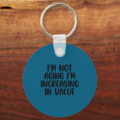 I'm Not Aging I'm Increasing In Value Funny Quotes キーホルダー (正面)