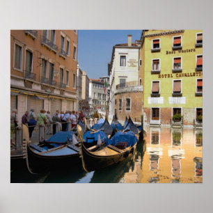 Italy, Venice, gondolas moored along canal ポスター