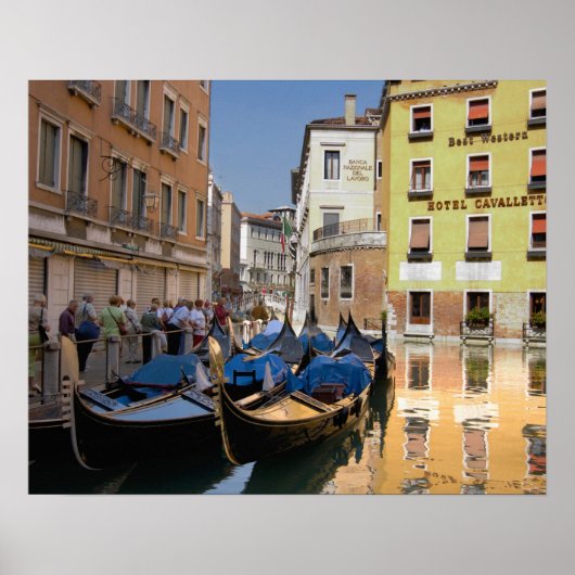Italy, Venice, gondolas moored along canal ポスター (正面)