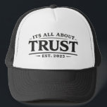 It's All About Trust キャップ<br><div class="desc">“It’s All About Trust.”

Simple words. Enduring principle.

Trust is the foundation behind everything that lasts—relationships,  leadership,  and the commitments we make every day. This hat keeps the message clear and visible: trust isn’t declared,  it’s demonstrated.

Clean design.
Timeless reminder.
Worn with intention.</div>