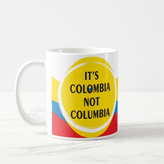 It's Colombia not Columbia コーヒーマグカップ (左)