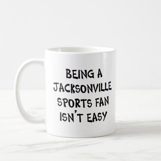 jacksonville sports fan, being コーヒーマグカップ (左)