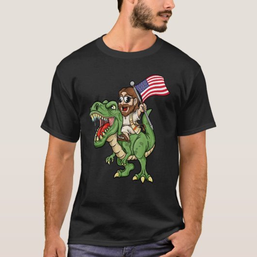 Jesus Riding A Tyrannosaurus Rex Dinosaur USA Flag Tシャツ (正面)