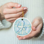 Joy Watercolor Ocean Sand Dollar Seashell Photo セラミックオーナメント<br><div class="desc">Who needs snowflakes when you have seashells! Capture a cool nautical casual and coastal vibe this holiday sea-son with our coastal seaside-inspired holiday Christmas collection. We've hand-painted a beautiful watercolor ocean sand dollar seashell in light turquoise and coastal blue to create a calm coastal vibe to shellabrate the holiday season....</div>