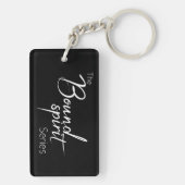 Keychainの傷つけられていたが、壊されなかった黒 キーホルダー (裏面)