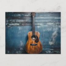 Klassische Gitarre an blauer rustikaler Holzwand