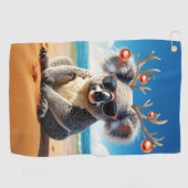 Koala on beach wearing Antlers and baubles ゴルフタオル (横)