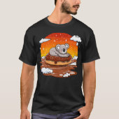 Koala On Donut Floating In Sunset Tシャツ (正面)