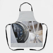 Kompas dat de richting geeft aan een avontuur. エプロン (正面)