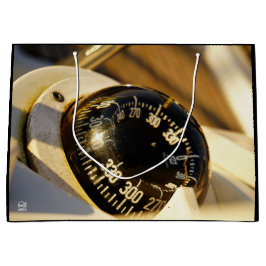 Kompas helpt navigeren en koer behouden.  ラージペーパーバッグ