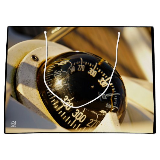 Kompas helpt navigeren en koer behouden.  ラージペーパーバッグ (正面)