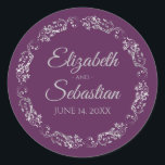 Lacy Silver Filigree Elegant Plum Purple Wedding ラウンドシール<br><div class="desc">These elegant wedding stickers feature fancy pale gray script text on a plum purple background with a lacy silver faux foil floral border. The text is fully customizable and contains the wedding couple's names and wedding date. Great as favor tags or envelope seals!</div>