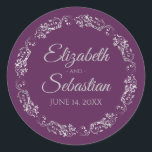 Lacy Silver Filigree Elegant Plum Purple Wedding ラウンドシール<br><div class="desc">These elegant wedding stickers feature fancy pale gray script text on a plum purple background with a lacy silver faux foil floral border. The text is fully customizable and contains the wedding couple's names and wedding date. Great as favor tags or envelope seals!</div>