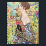 Lady with Fan by Gustav Klimt, Vintage Japonism ノートブック<br><div class="desc">Lady with Fan (1918) by Gustav Klimt is a vintage Victorian Era Symbolism fine art portrait painting. A beautiful brunette woman holding an oriental fan. The golden floral Japanese themed background is full of blooming exotic flowers, peacocks and other birds with outstretched wings. About the artist: Gustav Klimt (1862-1918) was...</div>
