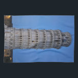 Leaning Tower at Dusk キッチンタオル<br><div class="desc">This captivating photograph showcases the iconic Leaning Tower of Pisa standing elegantly against a deep blue twilight sky in Pisa. The historic marble tower, famous for its unmistakable tilt, is beautifully illuminated, highlighting its intricate Romanesque arches and layered columns. The soft evening light creates a striking contrast between the glowing...</div>
