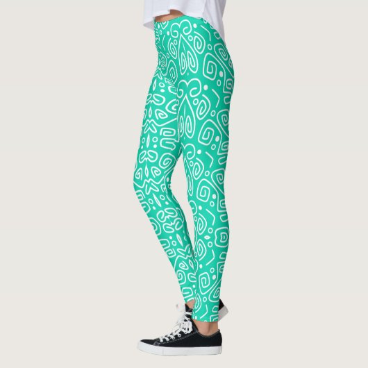 Leggings verde con líneas blancas redondeadas レギンス (左)