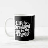 Life Is Dragging Me By The Thong  コーヒーマグカップ (左)