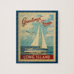 Long Island Sailboat Vintage Travel New York ジグソーパズル<br><div class="desc">This Greetings From Long Island New York vintage travel nautical design features a boat sailing on the water with seagulls and a blue sky filled with gorgeous puffy white clouds.</div>