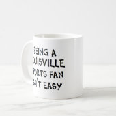 louisville sports fan, being コーヒーマグカップ (正面左)
