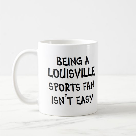 louisville sports fan, being コーヒーマグカップ (左)