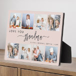 Love You Grandma 8 Photo Collage Blush Pink フォトプラーク<br><div class="desc">Give Grandma a gift she'll cherish. This photo collage plaque features eight of her favorite square photos of the grandkids, along with the message "Love You Grandma." The word "grandma" appears in elegant charcoal gray handwriting script with flourishes at the beginning and end on a blush pink background. Add the...</div>