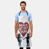 「MAKE ART NOT WAR」ハートマークの美しいアート - 少年の手を取り エプロン (着用した状態)