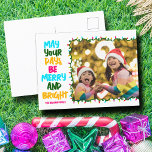 Merry Bright Pink Blue Christmas Lights Photo シーズンポストカード<br><div class="desc">Cute and cheerful family photo holiday postcards featuring a colorful strand of Christmas lights wrapped around your kids photograph. May Your Days Be Merry and Bright written in bold letters from light blue to your family name in hot pink. A rainbow of colors for the holidays.</div>