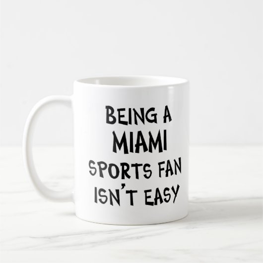 miami sports fan, being コーヒーマグカップ (左)