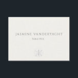 Minimalist Coastal Wedding  プレイスカード<br><div class="desc">Guide guests to their tables with calm, coastal elegance. These minimalist wedding escort cards feature refined serif typography on a warm ivory background, pairing guest names with table assignments in a clean, editorial layout. A whisper-soft sand dollar accent at the bottom adds a subtle seaside touch while keeping the focus...</div>