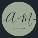 Minimalist Monogram Script Custom green Wedding ラウンドシール<br><div class="desc">Elevate your wedding details with the Minimalist Monogram Script Custom Wedding Date green Sticker. This elegant and personalized sticker adds a touch of sophistication to your wedding stationery, allowing you to showcase your monogram and wedding date in a simple yet impactful way. The sticker features a minimalist script design that...</div>