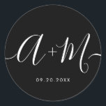 Minimalist Monogram Script Custom Wedding date ラウンドシール<br><div class="desc">Elevate your wedding details with the Minimalist Monogram Script Custom Wedding Date Sticker white text on black. This elegant and personalized sticker adds a touch of sophistication to your wedding stationery, allowing you to showcase your monogram and wedding date in a simple yet impactful way. The sticker features a minimalist...</div>