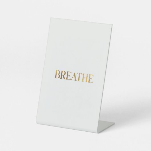 Minimalist typography with gold word breathe 台座サイン (正面)