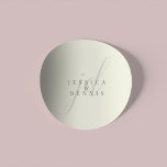 Modern Minimal Elegant Script Monogram Wedding ラウンドシール<br><div class="desc">Modern Minimal Elegant Script Monogram Wedding Classic Round Sticker Add a touch of elegance to your wedding with these modern, minimalist, and elegant script monogram classic round stickers. Crafted in classic ivory and storm dust colors, these stickers are perfect for sealing invitations, favor bags, or adding a personalized touch to...</div>