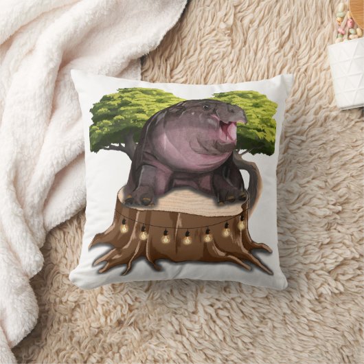 Moo Deng Hippo sits on a tree. クッション (ブランケット)