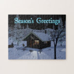 Moroz - Frost ジグソーパズル<br><div class="desc">A dark night in Siberia – bringing in a bit of wood for the fire,  conifer needles are covered in frost. Snowshoes by the door and the dog is hungry. Text reading "Season's Greetings" also appears in glowing blue and white.  Moroz (мороз) is the Russian word for frost.</div>
