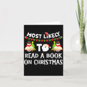 Most Likely To Read A Book On Christmas Funny Snow カード (正面)