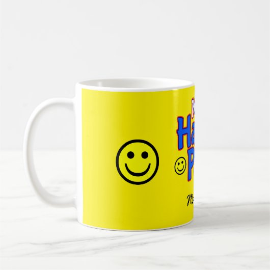 Mr.ハッピーパピスマイル絵文字と名前オンYELLOW コーヒーマグカップ (左)