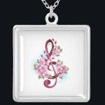 Musical treble clef notes with Sakura flowers シルバープレートネックレス<br><div class="desc">Pink treble clef with delicate,  detailed pink Japanese cherry blossoms against white background painted over with light blue paint. Blooming pink sakura.</div>
