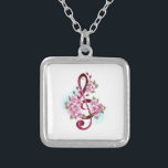 Musical treble clef notes with Sakura flowers シルバープレートネックレス<br><div class="desc">Pink treble clef with delicate,  detailed pink Japanese cherry blossoms against white background painted over with light blue paint. Blooming pink sakura.</div>