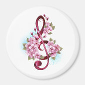 Musical treble clef notes with Sakura flowers マグネット (正面)