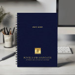 Navy Blue Leather Look Businessのロゴと名前 プランナー手帳<br><div class="desc">洗練されたネイビーブルーレザールックのデザインと機能を兼ね備えたデルのカスタムプロフェッショナルスパイラルプランナーを使用して、お客様のイメージを整理し、高めることができます。カバー上のカスタマイズ可能な正方形の宇宙を使用すると、金ゴールドテクスチャ上にビジネスロゴを目立つように表示できます。また、編集可能な文字の2つのラインは、あなたの会社名とタグラインのためのスペースを提供し、あなたのブランドがフロントとセンターであることを保証する。上部には、追加の文字の宇宙がある。このエレガントプランナーは、プロフェッショナルや中小企業が印象を残そうとする場合に最適である。弁護士、法律事務所、会計士、コンサルタント、不動産実在代理店、ファイナンシャルプランナー、医療事務所、保険代理店、建築家、設計者、教育者に最適である。スケジュール設定、クライアントミーティング、戦略計画のいずれに使用される場合でも、このスパイラルにバインドされたプランナーは、スタイルと団体や組織を組み合わせてビジネスの成功をサポートする。実用性とブランディングのために設計されたカスタムプランナースパイラルは、クライアントや同僚に印象を与えたいと思うプロフェッショナルのための優れたオフィス不可欠または思慮深いプロモーションギフトを作る。</div>