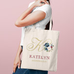 Navy Gold Wine Floral Custom Wedding Bridal Party トートバッグ<br><div class="desc">Elegant custom tote bag features a script initial accented with a beautiful watercolor floral bouquet in navy blue,  wine red,  and blush pink with greenery. Personalize the initial,  first name,  and bridal party title. Makes a unique gift for your bridesmaids and other members of your bridal party.</div>